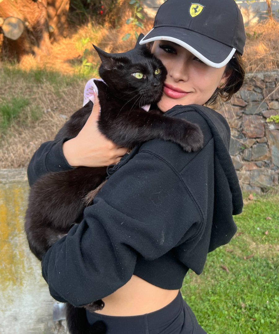 Alejandra holding Kat in the garden